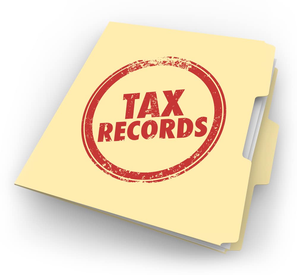 "TAX RECORDS" stamped on a file folder