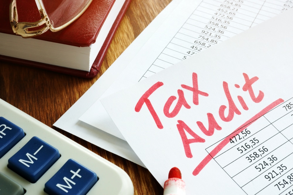 "Tax Audit" handwritten on business accounting documents
