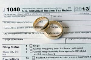 Wedding rings on top of an income tax return.